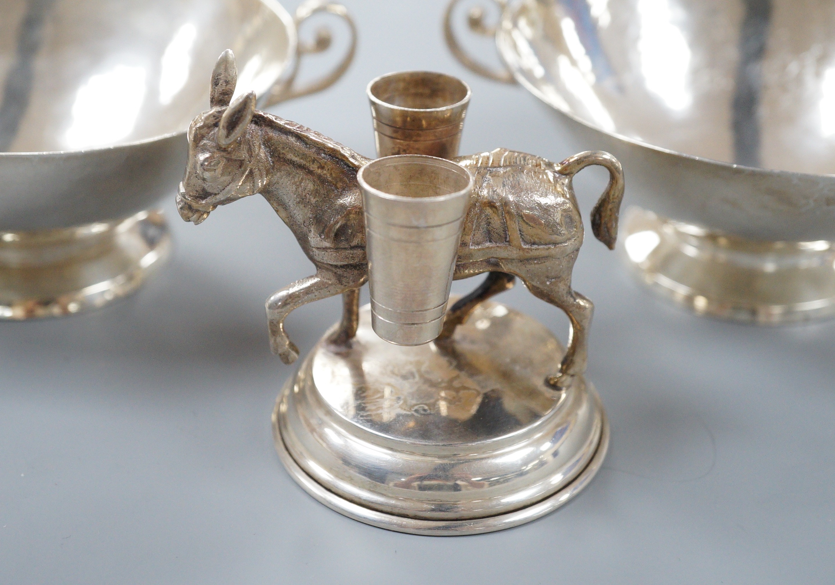 Two Chilean Hecho Amano 900 standard white metal two handle finger bowls, diameter 13.5cm and a Spanish white metal donkey vesta vase, 68mm.